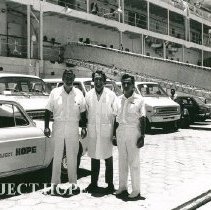 Dr William B Walsh, Dennis Lucey and Dr Martin Shearn in front of SS HOPE